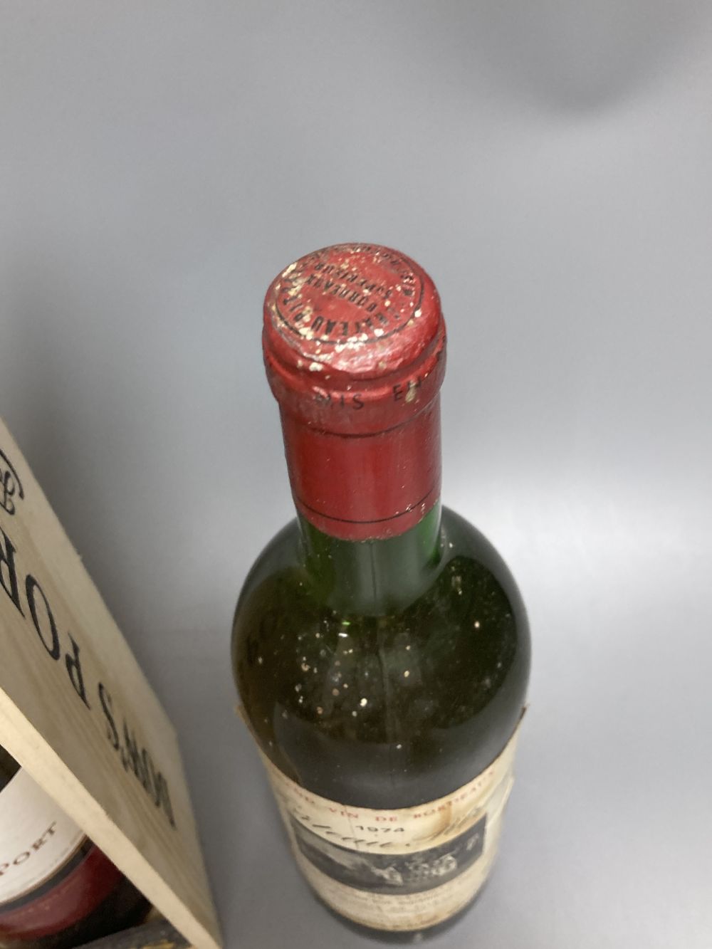 One bottle of Dows Christmas Port and a bottle of Chateau Pitray 1974
